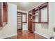 Large walk-in closet with custom wood shelving and ample storage space at 140 E Rio Salado Pkwy # 402, Tempe, AZ 85281