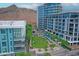Contemporary condo complex with a central green space, seating areas, and mountain views in the background at 140 E Rio Salado Pkwy # 402, Tempe, AZ 85281