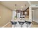 Modern kitchen bar with granite countertop, stainless steel appliances and pendant lights at 140 E Rio Salado Pkwy # 402, Tempe, AZ 85281