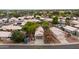 Aerial view of single-Gathering home in a residential area with mature landscaping and block perimeter wall at 15715 W Cottonwood St, Surprise, AZ 85374