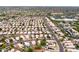 Overhead view of a community with solar panels, landscaped yards, and a mix of residential properties at 15715 W Cottonwood St, Surprise, AZ 85374