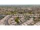 Expansive aerial view of a residential neighborhood, highlighting the well-maintained homes and community spaces at 15715 W Cottonwood St, Surprise, AZ 85374