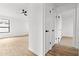 Bedroom view showcases light wood floors and storage closets with easy access to the hall at 15715 W Cottonwood St, Surprise, AZ 85374