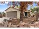 Beautiful single-Gathering home with mature trees, a two-car garage, and desert landscaping at 15715 W Cottonwood St, Surprise, AZ 85374