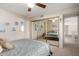 Bright bedroom with mirrored closet and ceiling fan at 1625 E Monte Cristo Ave, Phoenix, AZ 85022