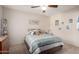 Bedroom with soft lighting, ceiling fan, carpet, and decorative shelves at 1625 E Monte Cristo Ave, Phoenix, AZ 85022