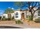 Charming home featuring an arched entryway, desert landscaping, and a tiled roof at 1625 E Monte Cristo Ave, Phoenix, AZ 85022