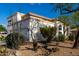 Rear of a two-story home featuring a balcony and desert landscaping at 1625 E Monte Cristo Ave, Phoenix, AZ 85022