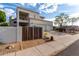 Two-story home featuring an attached three car garage and a gated front yard at 1625 E Monte Cristo Ave, Phoenix, AZ 85022