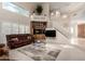 Bright living room with soaring ceilings, large windows, and adjacent stairway at 1625 E Monte Cristo Ave, Phoenix, AZ 85022