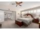 Spacious primary bedroom with vaulted ceiling, fan, and sitting area at 1625 E Monte Cristo Ave, Phoenix, AZ 85022