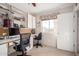 Bright office space with a ceiling fan, built in desk and shelves at 1625 E Monte Cristo Ave, Phoenix, AZ 85022