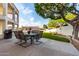 Back patio with outdoor dining and BBQ area overlooks the landscaped yard at 1625 E Monte Cristo Ave, Phoenix, AZ 85022