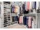 Walk-in closet with shelving and hanging storage for shoes and clothing at 1625 E Monte Cristo Ave, Phoenix, AZ 85022
