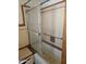 A bathroom with a shower and tub. This bathroom has a sliding glass shower door at 1630 E Catalina Dr, Phoenix, AZ 85016