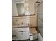 Dated bathroom features a vanity, mirror, and tiled shower needing updates at 1630 E Catalina Dr, Phoenix, AZ 85016