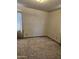 A plain bedroom with a window, offering a blank canvas for customization at 1630 E Catalina Dr, Phoenix, AZ 85016