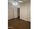 Bedroom with door to an en-suite bathroom, ceiling fan, and electrical outlets at 1630 E Catalina Dr, Phoenix, AZ 85016