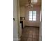 Compact kitchen area featuring wood-look cabinets and a small window with natural light at 1630 E Catalina Dr, Phoenix, AZ 85016
