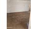 View of the empty living room showing an electrical outlet, paint defects and trim at 1630 E Catalina Dr, Phoenix, AZ 85016