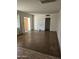 Spacious living room with a large window and doorway leading to another room at 1630 E Catalina Dr, Phoenix, AZ 85016