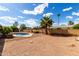 Relaxing backyard featuring a private pool, a mature palm tree, and ample space at 1650 E Gary St, Mesa, AZ 85203