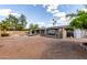 Spacious backyard featuring a refreshing pool, mature trees and a patio at 1650 E Gary St, Mesa, AZ 85203
