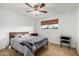 Cozy bedroom features a comfortable bed and a window view at 1650 E Gary St, Mesa, AZ 85203