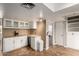 Well-lit kitchen with ample cabinet space, modern appliances and neutral tile flooring at 1650 E Gary St, Mesa, AZ 85203
