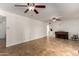 Open-concept living room with tile floors, ceiling fan, and space for entertaining at 1650 E Gary St, Mesa, AZ 85203
