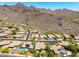 Community aerial view of desert homes with lush landscaping, pools and mountain views at 16562 N 109Th Way, Scottsdale, AZ 85255