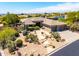 An elevated shot reveals a beautifully landscaped property with a private courtyard and desert surroundings at 16562 N 109Th Way, Scottsdale, AZ 85255