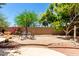 Backyard showcasing an outdoor dining area and desert landscaping at 16562 N 109Th Way, Scottsdale, AZ 85255