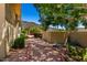 An inviting backyard shows meticulous xeriscaping, mature trees, and a serene, private outdoor space at 16562 N 109Th Way, Scottsdale, AZ 85255