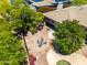 Aerial view of backyard with brick patio, outdoor seating, and desert plants at 16562 N 109Th Way, Scottsdale, AZ 85255