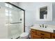 Bathroom featuring a shower, toilet, and bright mirror at 16562 N 109Th Way, Scottsdale, AZ 85255