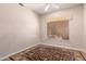 Neutral carpeted bedroom with a patterned rug and natural light at 16562 N 109Th Way, Scottsdale, AZ 85255