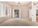 An open bedroom featuring plantation shutters, and an ensuite bath with dual vanities at 16562 N 109Th Way, Scottsdale, AZ 85255