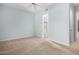 Open bedroom with carpet, ceiling fan, and bathroom view at 16562 N 109Th Way, Scottsdale, AZ 85255