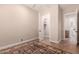 Bedroom with a patterned rug and bathroom and closet views at 16562 N 109Th Way, Scottsdale, AZ 85255