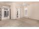 Spacious carpeted bedroom with an open ensuite bath and walk-in closet at 16562 N 109Th Way, Scottsdale, AZ 85255