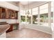 Bright breakfast nook with large windows overlooking the backyard at 16562 N 109Th Way, Scottsdale, AZ 85255