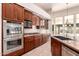 An open kitchen featuring stainless steel appliances, custom cabinetry and a center island at 16562 N 109Th Way, Scottsdale, AZ 85255
