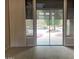 Light-filled living room with sliding glass doors providing scenic views of the pool and outdoor area at 16562 N 109Th Way, Scottsdale, AZ 85255