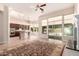 Bright living room area with large windows, open layout, and direct access to the kitchen at 16562 N 109Th Way, Scottsdale, AZ 85255
