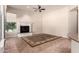 Living room featuring fireplace and large windows at 16562 N 109Th Way, Scottsdale, AZ 85255