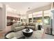 Spacious open-concept living area with natural light and modern furnishings at 16562 N 109Th Way, Scottsdale, AZ 85255