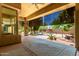 Covered patio showcasing beautiful desert landscaping and tranquil outdoor living at 16562 N 109Th Way, Scottsdale, AZ 85255
