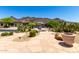 Spacious patio with desert landscaping offers serene outdoor living with desert mountain views at 16562 N 109Th Way, Scottsdale, AZ 85255