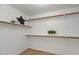 Walk-in closet features built-in shelves and space to organize all your garments at 1761 E Countrywalk Ln, Chandler, AZ 85225